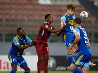 Nicholas Strickland (top 2nd right) heads the ball during the Malta 360 Sports Premier League soccer match between Gzira United and Sliema W...