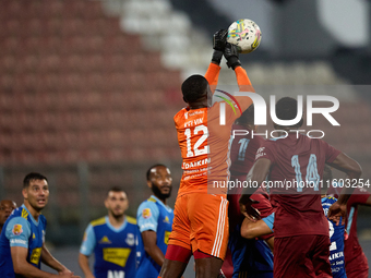 Emeka Kelvin Agu, goalkeeper of Sliema Wanderers, punches the ball during the Malta 360 Sports Premier League soccer match between Gzira Uni...