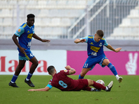 In Ta' Qali, Malta, on September 21, 2024, Zachary Scerri (center) of Gzira United competes for the ball with Myles Beerman (right) of Sliem...