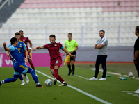 Zachary Scerri (C) of Gzira United is in action during the Malta 360 Sports Premier League soccer match between Gzira United and Sliema Wand...