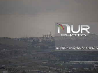 A general view of electric towers on a cloudy day due to smoke from wildfires in Lisbon, Portugal, on September 22, 2024. The fires that beg...