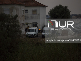 People cook with fire in cloudy weather due to smoke from wildfires in Lisbon, Portugal, on September 22, 2024. The fires that begin on Sept...