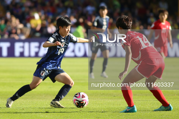 Miyu Matsunaga of Japan and Shinomi Koyama of Korea DPR fight for the ball during the FIFA U-20 Women's World Cup Colombia 2024 final match...