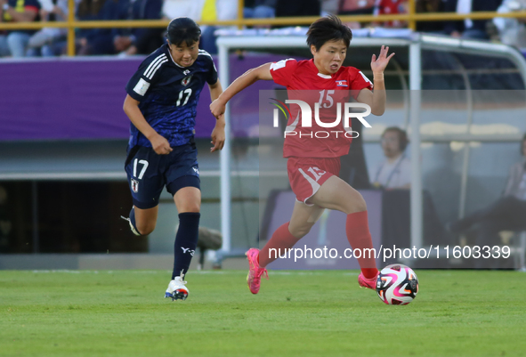 Uno Shiragaki of Japan and Il-Son Choe of Korea DPR fight for the ball during the FIFA U-20 Women's World Cup final match between Korea DPR...