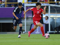 Uno Shiragaki of Japan and Il-Son Choe of Korea DPR fight for the ball during the FIFA U-20 Women's World Cup final match between Korea DPR...