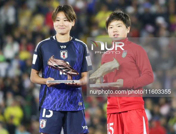 Maya Hijikata of Japan poses with Choe Il Son of Korea DPR with the Adidas Bronze Boot and Adidas Golden Boot awards after the FIFA U-20 Wom...