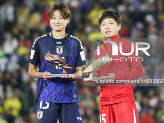 Maya Hijikata of Japan poses with Choe Il Son of Korea DPR with the Adidas Bronze Boot and Adidas Golden Boot awards after the FIFA U-20 Wom...