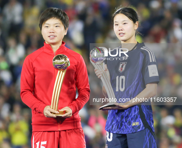 Choe Il Son of Korea DPR poses with the Adidas Golden Ball award and Manaka Matsukubo of Japan poses with the Adidas Silver Ball Award after...