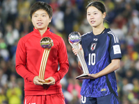 Choe Il Son of Korea DPR poses with the Adidas Golden Ball award and Manaka Matsukubo of Japan poses with the Adidas Silver Ball Award after...