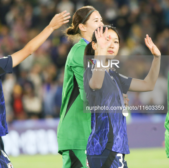 Japan's Raika Okamura waves to fans at the 2024 FIFA U-20 Women's World Cup final match between the United States and the Netherlands at the...