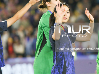 Japan's Raika Okamura waves to fans at the 2024 FIFA U-20 Women's World Cup final match between the United States and the Netherlands at the...