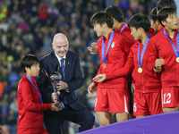 Gianni Infantino gives the trophy to the Korea DPR players during the FIFA U-20 Women's World Cup Colombia 2024 final match between Korea DP...