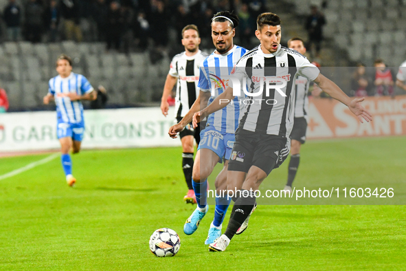 Stefan Baiaram and Lucian Iulian Cristea are in action during the match between Universitatea Cluj and Universitatea Craiova at Cluj Arena S...