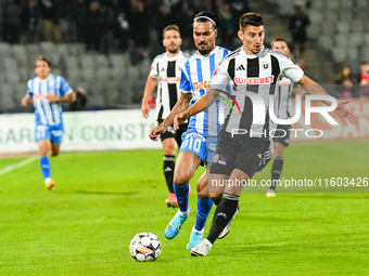 Stefan Baiaram and Lucian Iulian Cristea are in action during the match between Universitatea Cluj and Universitatea Craiova at Cluj Arena S...