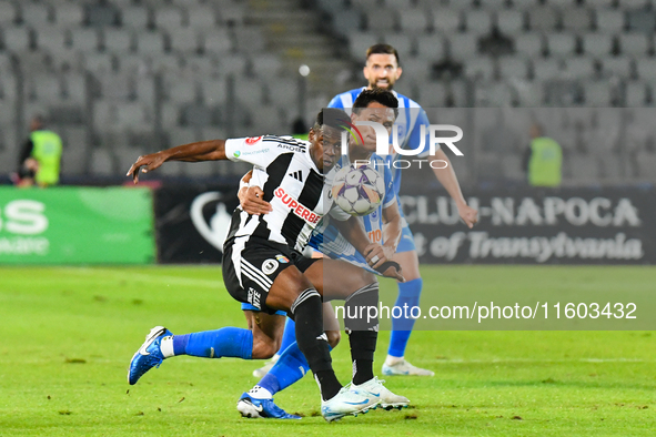 Mamadou Thiam and Denil Omar Maldonado Munguia are in action during the match between Universitatea Cluj and Universitatea Craiova at Cluj A...