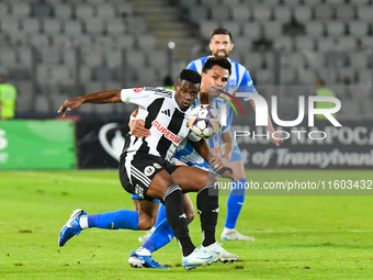 Mamadou Thiam and Denil Omar Maldonado Munguia are in action during the match between Universitatea Cluj and Universitatea Craiova at Cluj A...