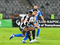 Mamadou Thiam and Denil Omar Maldonado Munguia are in action during the match between Universitatea Cluj and Universitatea Craiova at Cluj A...