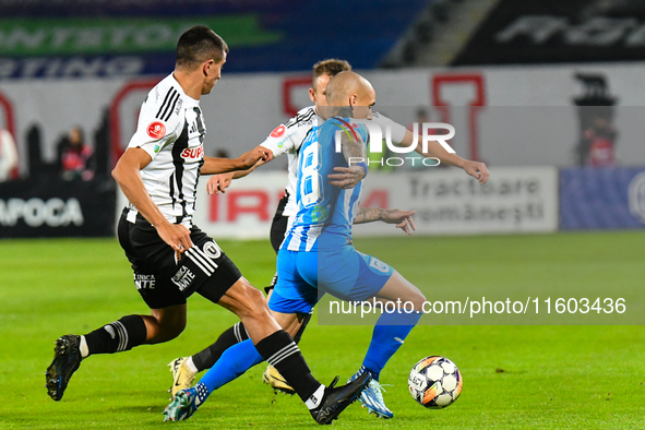 Ionut Alexandru Mitrita is in action during the match between Universitatea Cluj and Universitatea Craiova at Cluj Arena Stadium in Cluj, Ro...