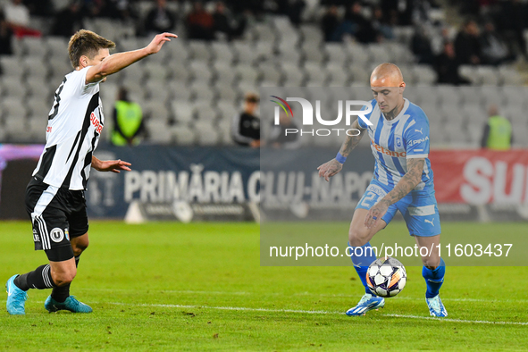 Ionut Alexandru Mitrita and Gabriel Bogdan Simion are in action during the match between Universitatea Cluj and Universitatea Craiova at Clu...