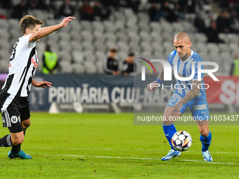 Ionut Alexandru Mitrita and Gabriel Bogdan Simion are in action during the match between Universitatea Cluj and Universitatea Craiova at Clu...