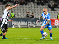 Ionut Alexandru Mitrita and Gabriel Bogdan Simion are in action during the match between Universitatea Cluj and Universitatea Craiova at Clu...