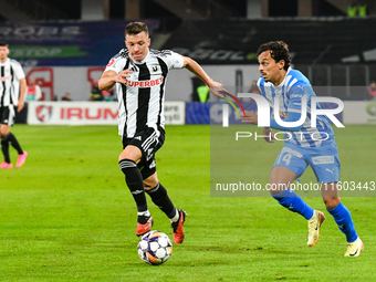 Lyes Hafid Houri and Vadim Rata are in action during the match between Universitatea Cluj and Universitatea Craiova at Cluj Arena Stadium in...