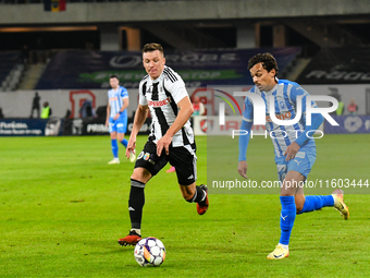 Lyes Hafid Houri and Vadim Rata are in action during the match between Universitatea Cluj and Universitatea Craiova at Cluj Arena Stadium in...