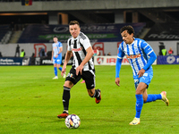 Lyes Hafid Houri and Vadim Rata are in action during the match between Universitatea Cluj and Universitatea Craiova at Cluj Arena Stadium in...