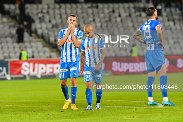 Nicusor Silviu Bancu and Ionut Alexandru Mitrita react during the match between Universitatea Cluj and Universitatea Craiova at Cluj Arena S...