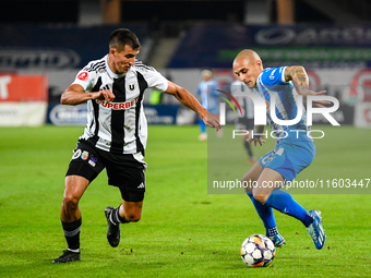 Ionut Alexandru Mitrita and Lucas Gabriel Masoero are in action during the match between Universitatea Cluj and Universitatea Craiova at Clu...