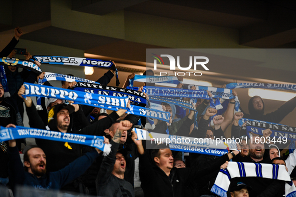 Fans of Universitatea Craiova attend the match between Universitatea Cluj and Universitatea Craiova in Cluj, Romania, on September 22, 2024 