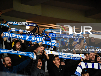 Fans of Universitatea Craiova attend the match between Universitatea Cluj and Universitatea Craiova in Cluj, Romania, on September 22, 2024...