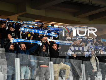 Fans of Universitatea Craiova attend the match between Universitatea Cluj and Universitatea Craiova in Cluj, Romania, on September 22, 2024...