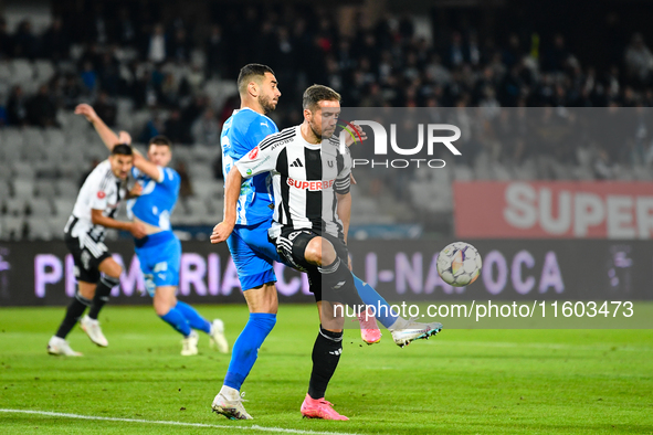 Mihaita Alexandru Chipciu and Vladimir Ionut Screciu are in action during the match between Universitatea Cluj and Universitatea Craiova at...