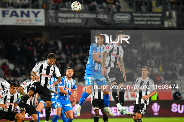 Radu Stefanita Boboc and Virgil Andrei Ivan are in action during the match between Universitatea Cluj and Universitatea Craiova at Cluj Aren...