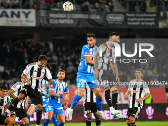 Radu Stefanita Boboc and Virgil Andrei Ivan are in action during the match between Universitatea Cluj and Universitatea Craiova at Cluj Aren...