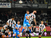 Radu Stefanita Boboc and Virgil Andrei Ivan are in action during the match between Universitatea Cluj and Universitatea Craiova at Cluj Aren...