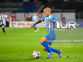 Ionut Alexandru Mitrita is in action during the match between Universitatea Cluj and Universitatea Craiova at Cluj Arena Stadium in Cluj, Ro...