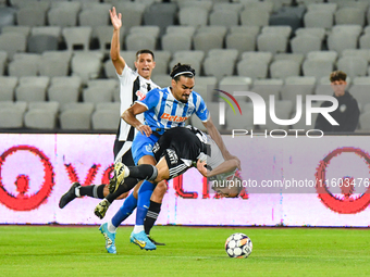 Stefan Baiaram and Robert Mihai Silaghi are in action during the match between Universitatea Cluj and Universitatea Craiova at Cluj Arena St...