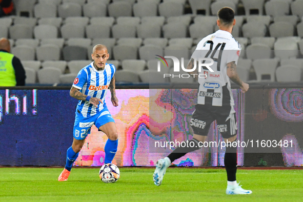 Ionut Alexandru Mitrita is in action during the match between Universitatea Cluj and Universitatea Craiova at Cluj Arena Stadium in Cluj, Ro...