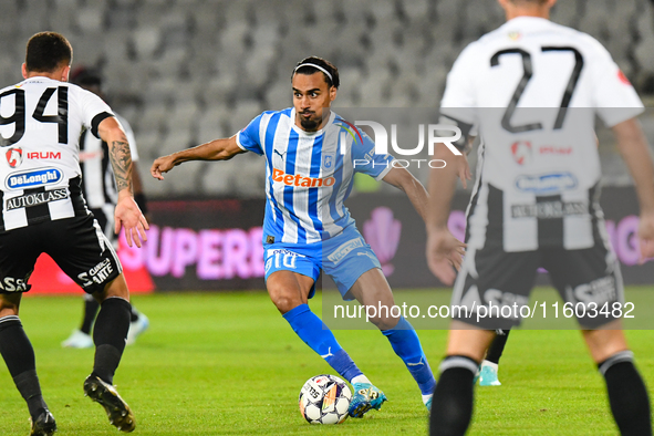 Stefan Baiaram is in action during the match between Universitatea Cluj and Universitatea Craiova at Cluj Arena Stadium in Cluj, Romania, on...