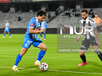 Luis Javier Paradela Diaz and Mihaita Alexandru Chipciu are in action during the match between Universitatea Cluj and Universitatea Craiova...