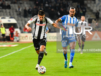 Stefan Baiaram and Lucian Iulian Cristea are in action during the match between Universitatea Cluj and Universitatea Craiova at Cluj Arena S...