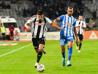 Stefan Baiaram and Lucian Iulian Cristea are in action during the match between Universitatea Cluj and Universitatea Craiova at Cluj Arena S...