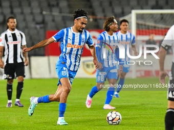 Stefan Baiaram is in action during the match between Universitatea Cluj and Universitatea Craiova at Cluj Arena Stadium in Cluj, Romania, on...