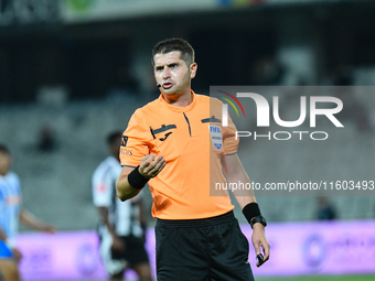 Andrei Florin Chivulete officiates the match between Universitatea Cluj and Universitatea Craiova at Cluj Arena Stadium in Cluj, Romania, on...