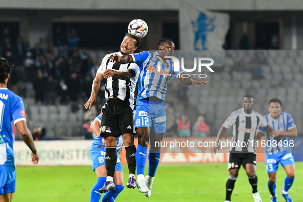 Hildeberto Jose Morgado Pereira and Basilio Ndong Owono Nchama are in action during the match between Universitatea Cluj and Universitatea C...