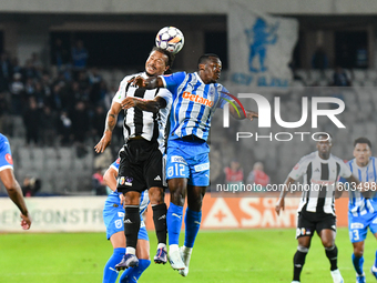 Hildeberto Jose Morgado Pereira and Basilio Ndong Owono Nchama are in action during the match between Universitatea Cluj and Universitatea C...