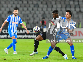 Mamadou Thiam and Denil Omar Maldonado Munguia are in action during the match between Universitatea Cluj and Universitatea Craiova at Cluj A...