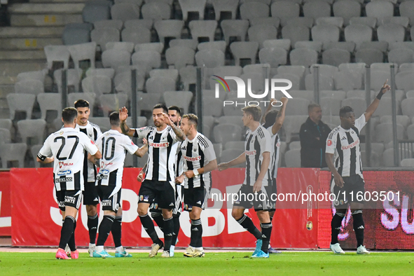 Players of Universitatea Cluj celebrate during the match between Universitatea Cluj and Universitatea Craiova at Cluj Arena Stadium in Cluj,...